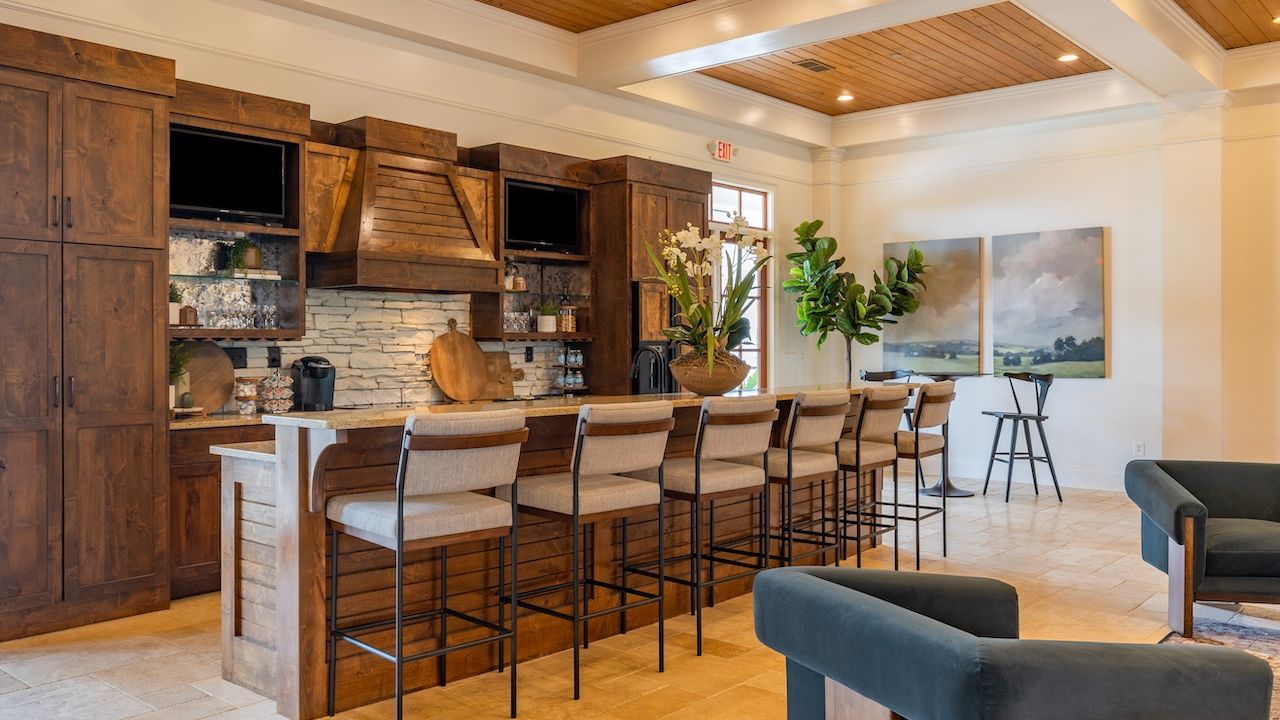Beautiful resident clubhouse amenity area with entertainment space and a large island with seating